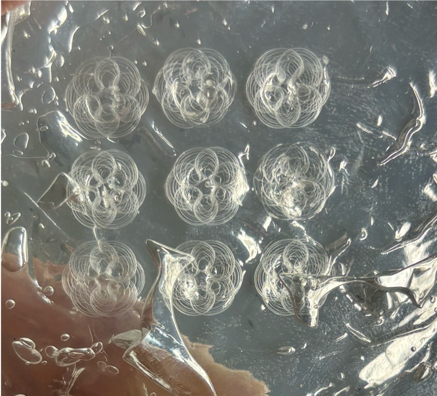 Bottom view of nine printed skeins arranged in a three-by-three grid
